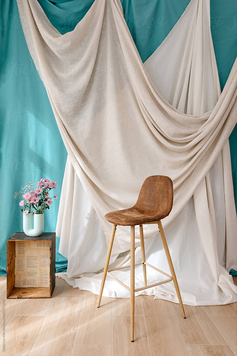 Interior of photo studio with chair and flowers