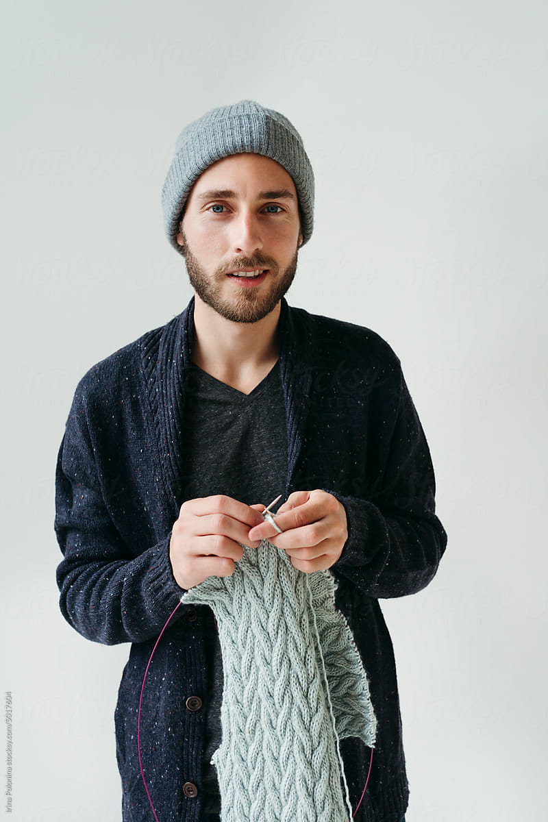 Portrait of knitting crafty modern man.