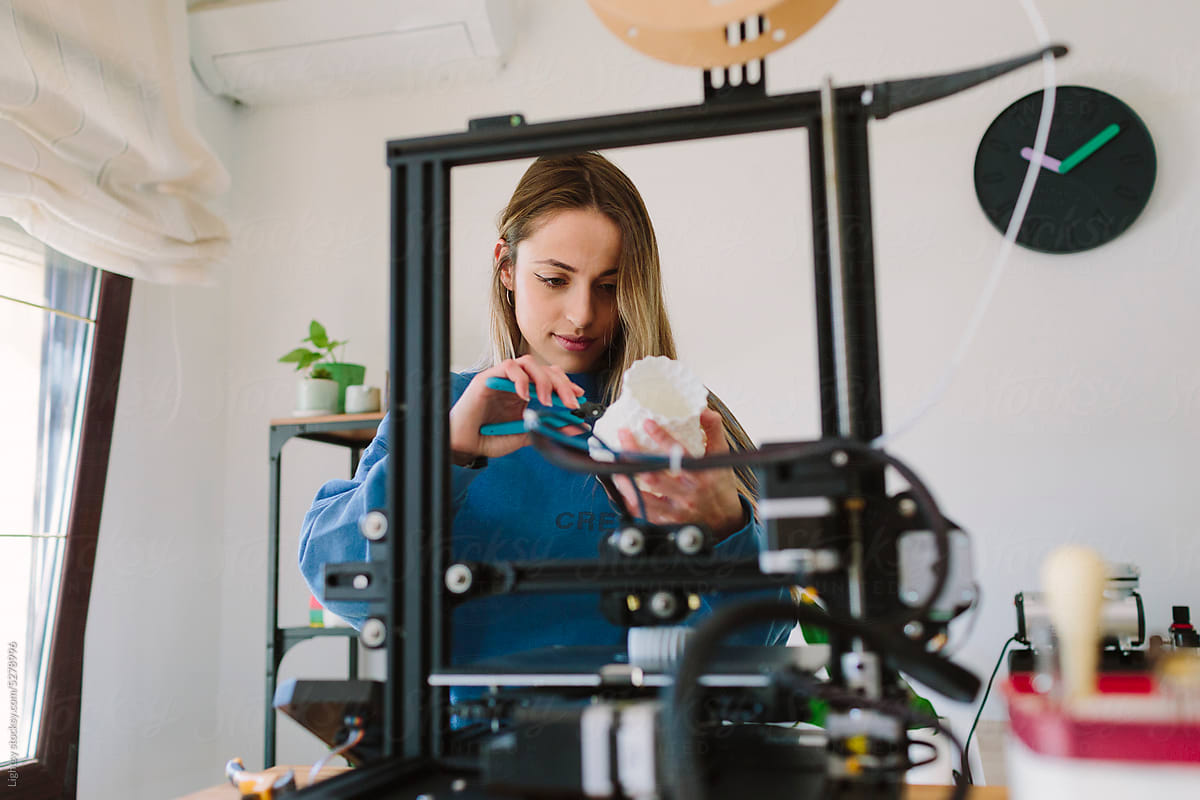 Woman using a 3D printer
