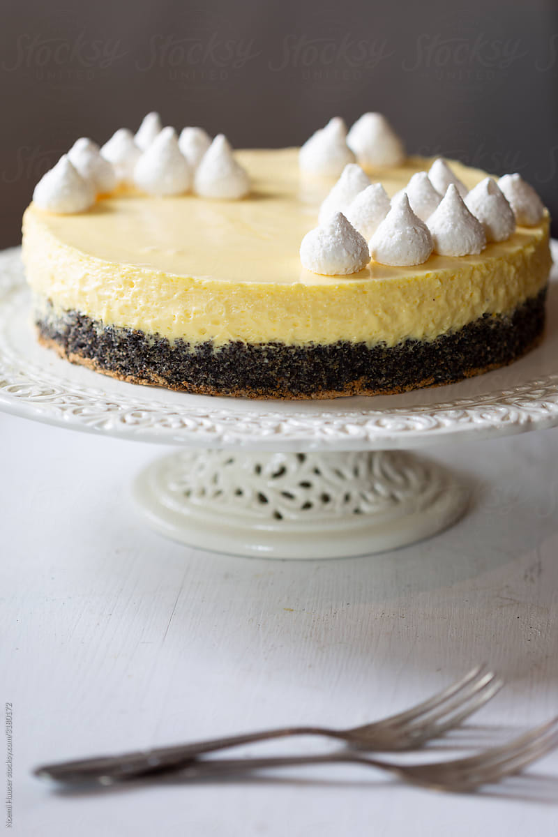 Lemon flavored white chocolate mousse cake and meringue