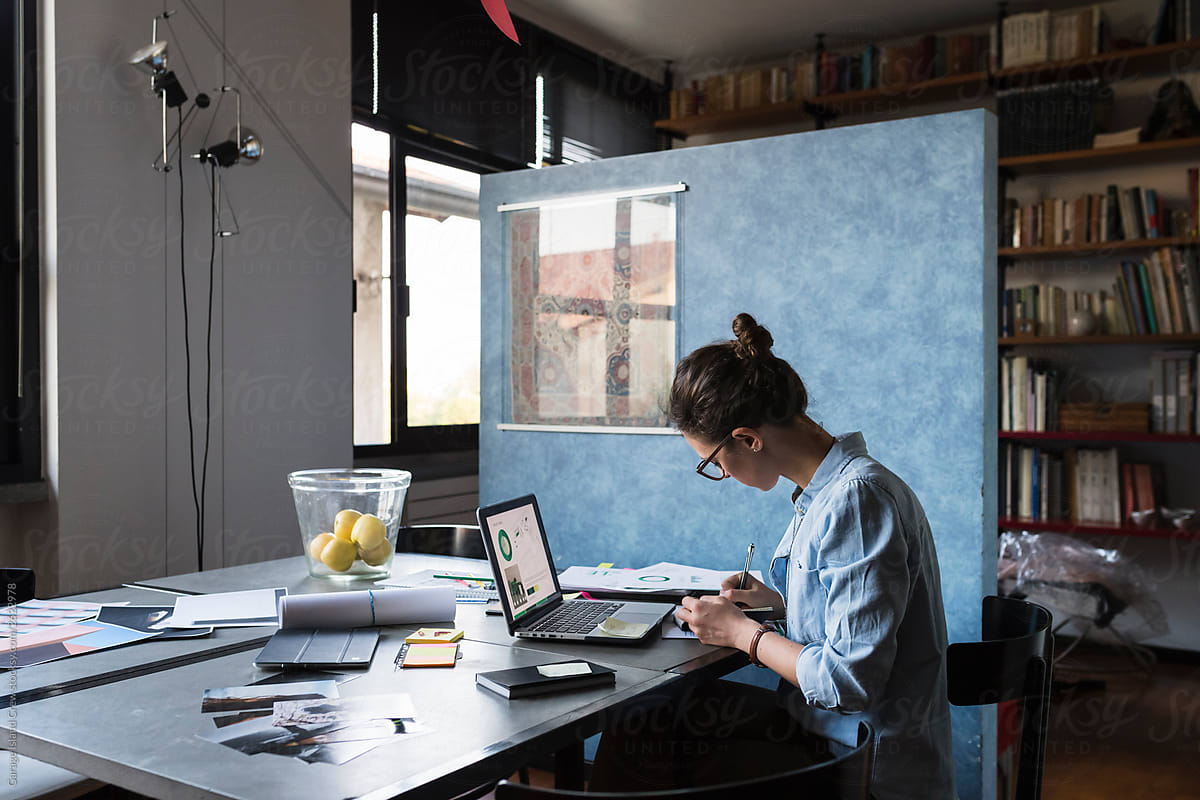 Architect woman working from her studio office at home