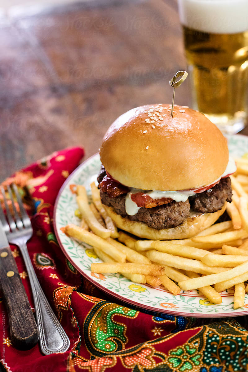 Bacon beef burger with french fries and beer