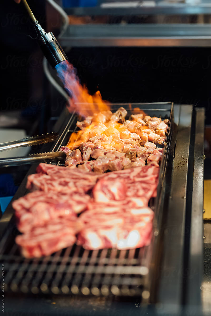 Street food: flame grilled beef in night market of Taiwan
