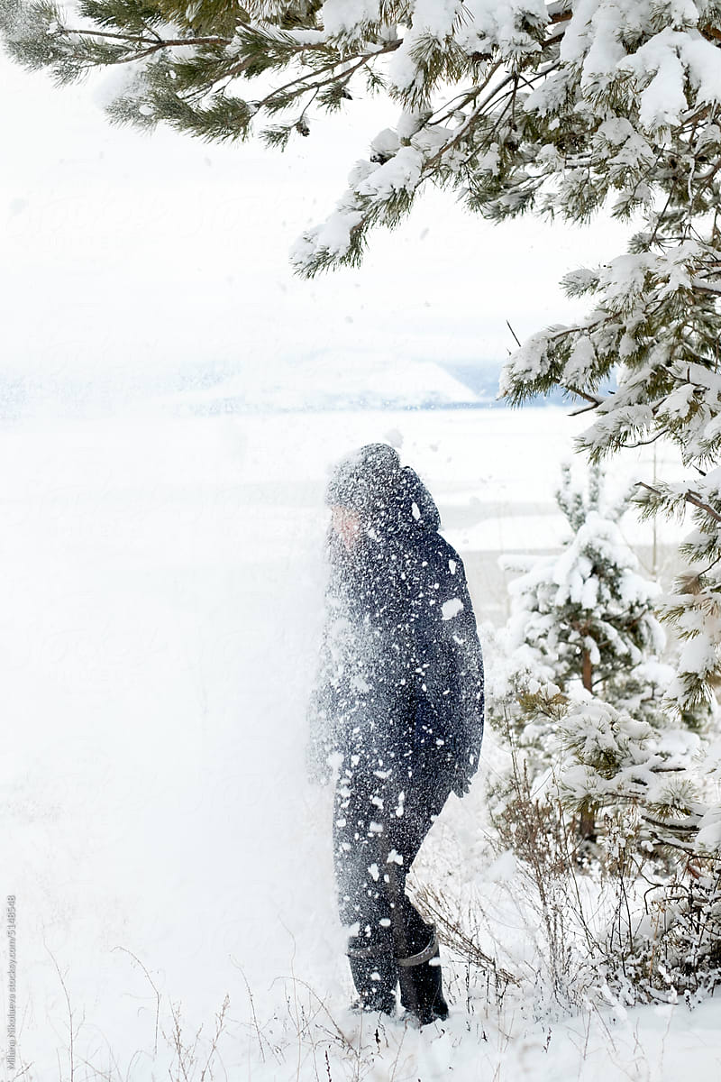 A woman walking in the winter forest