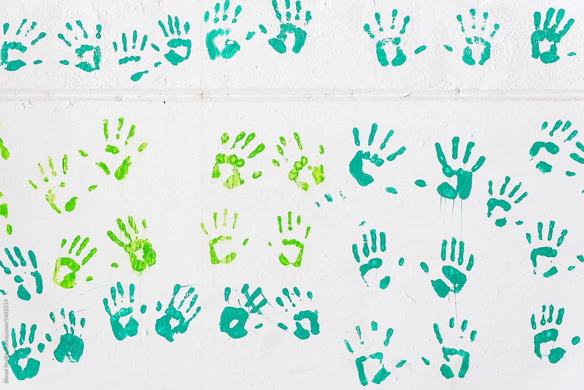Hand prints on a wall of some three year old childs