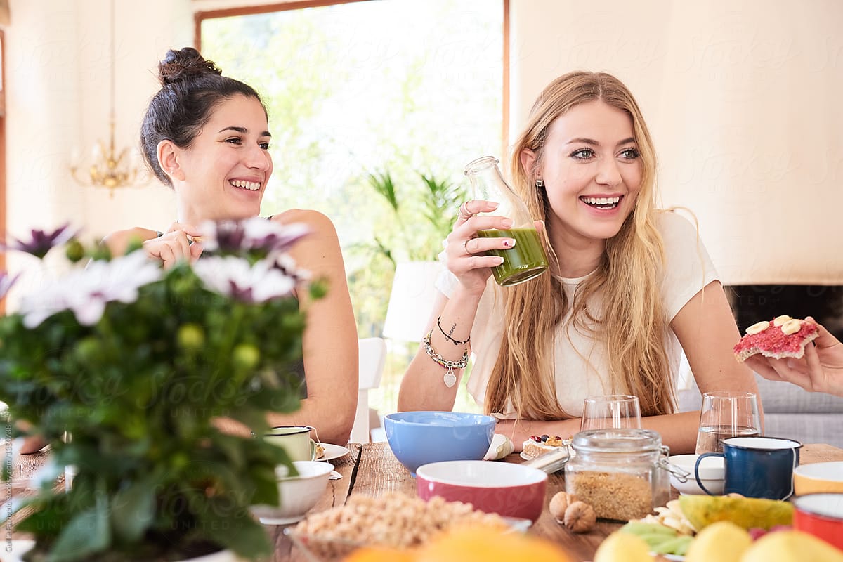 Happy Girlfriends Eating Healthy Breakfast By Stocksy Contributor Guille Faingold Stocksy 1060