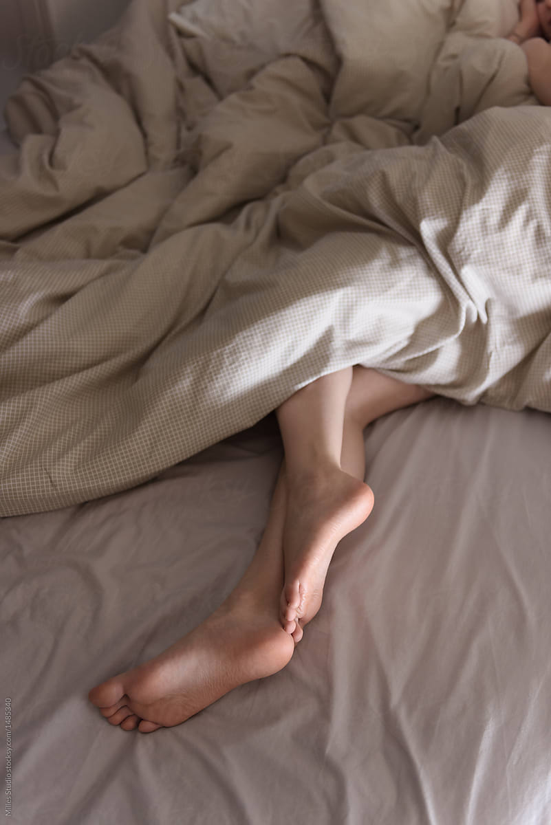 Legs of sleeping woman