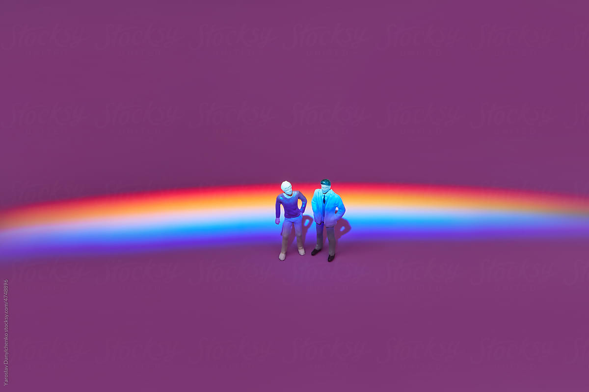 Men figures with rainbow prism reflection.