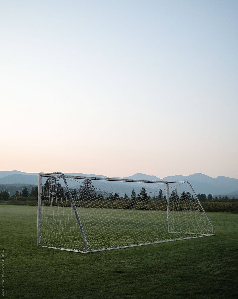 Soccer goal post with mountains in the background
