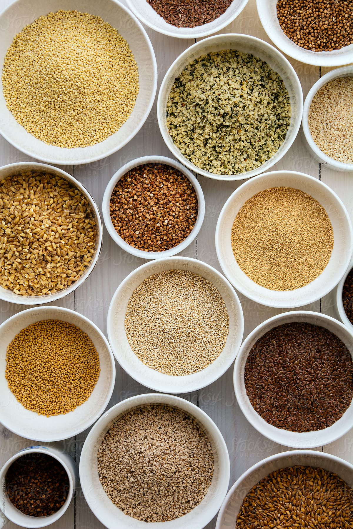 Various health seeds and grains arranged in bowls
