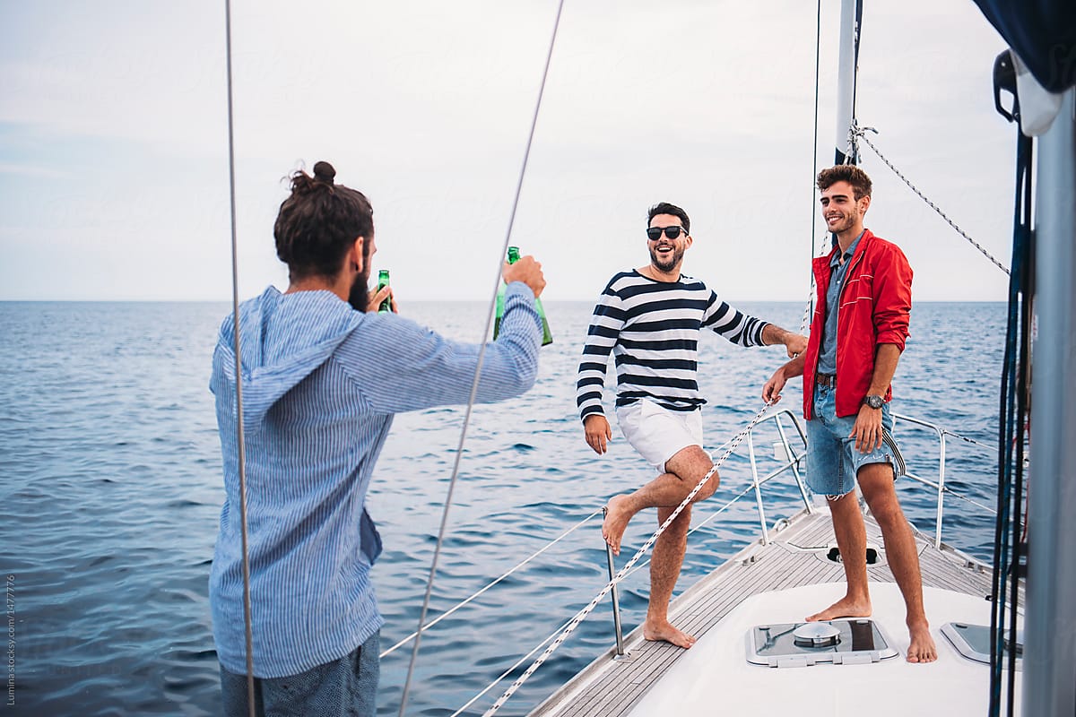 Group of Men Having Fun Time on Sailing Boat
