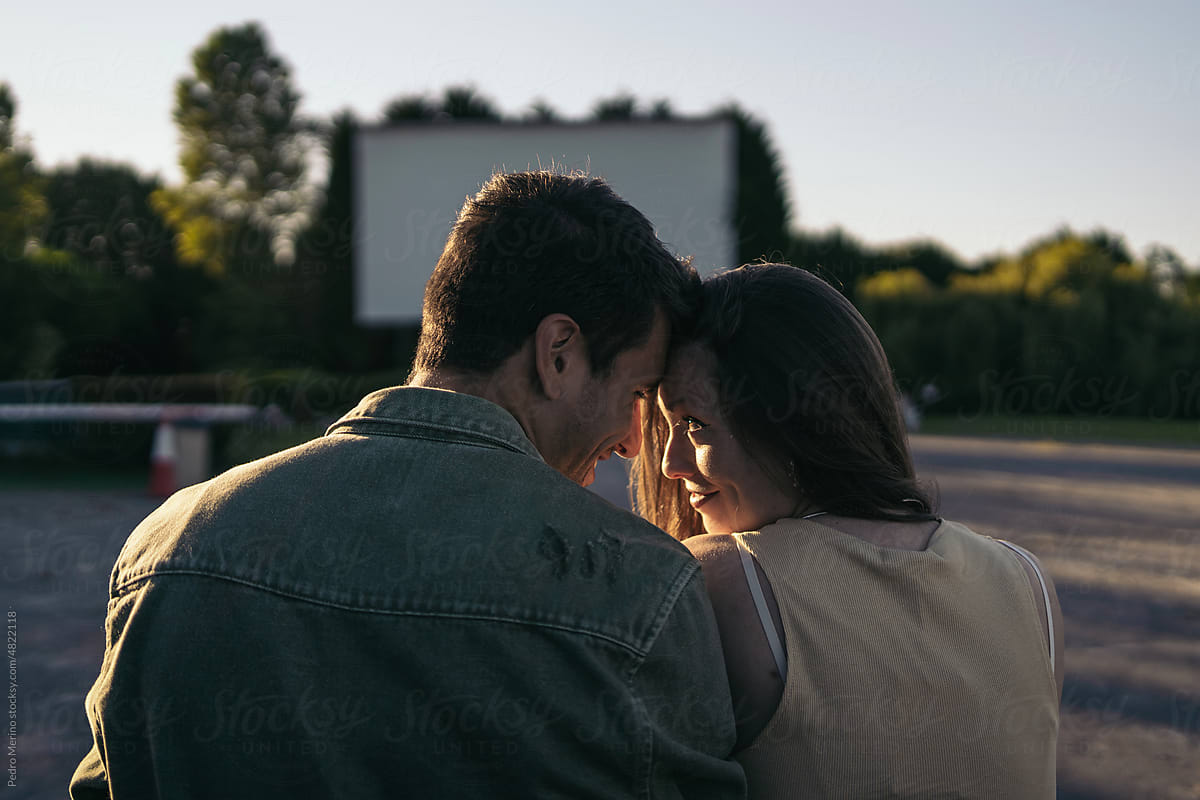 Couple dating at an outdoor drive-in cinema