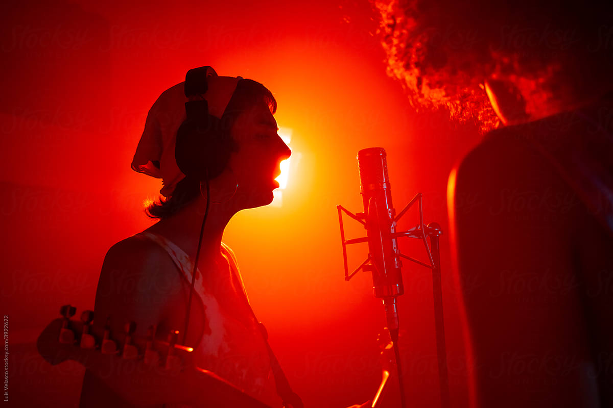 Silhouette Young Woman Singing In The Studio.