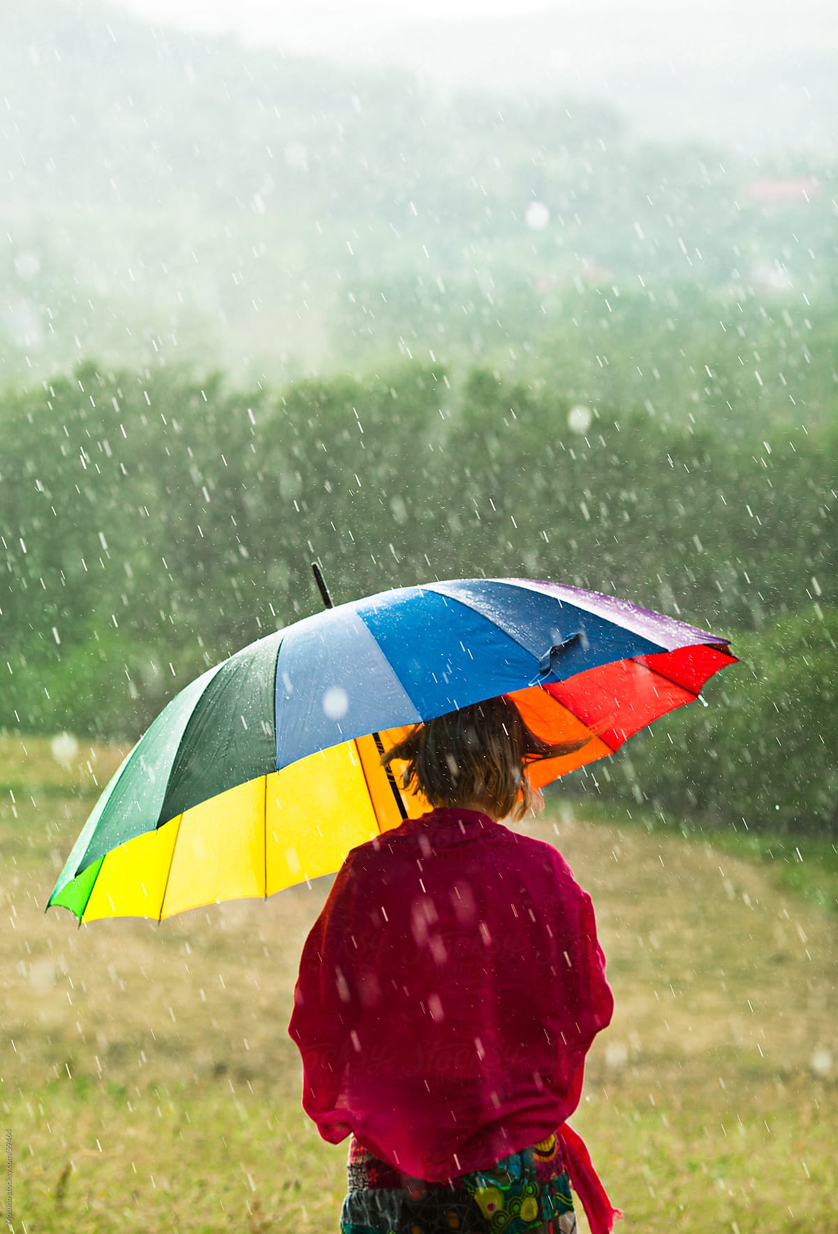Woman With Colorful Umbrella Enjoying Rain In The Meadow By Mosuno Rain Umbrella Stocksy United