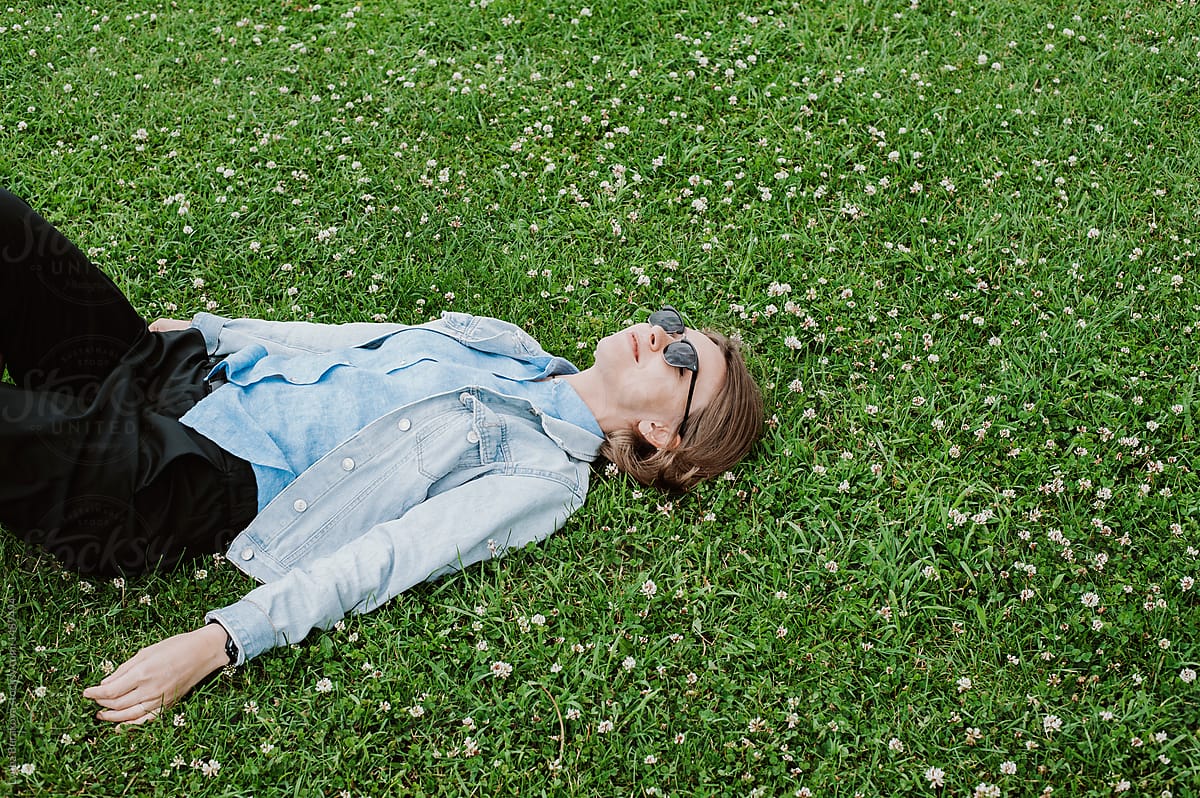 Woman Lying On A Grass By Stocksy Contributor Amor Burakova Stocksy