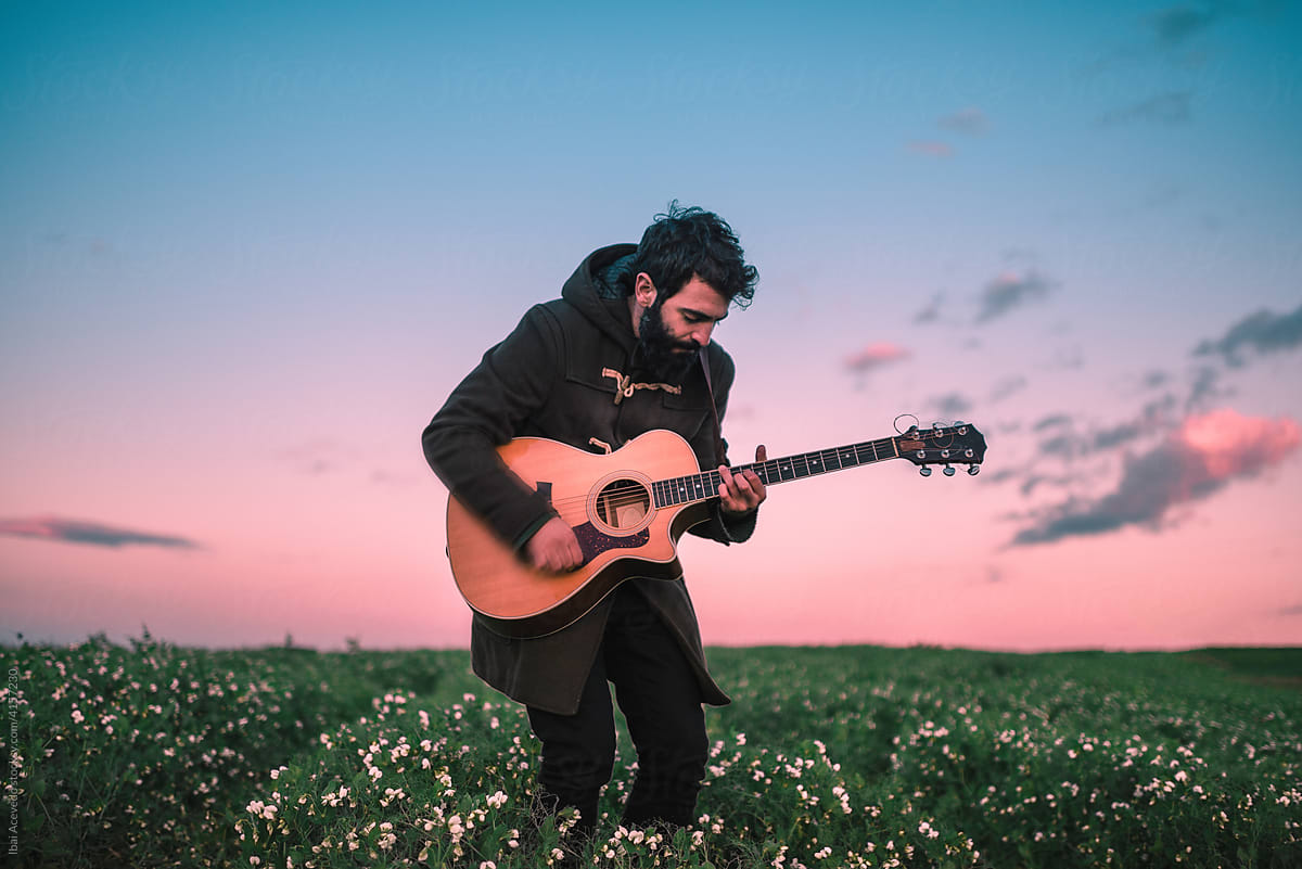 Guitarist playing outdoors