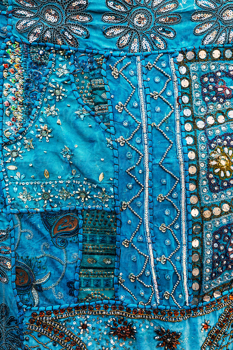 Decorative pattern on a blue traditional Indian piece of fabric. India texture