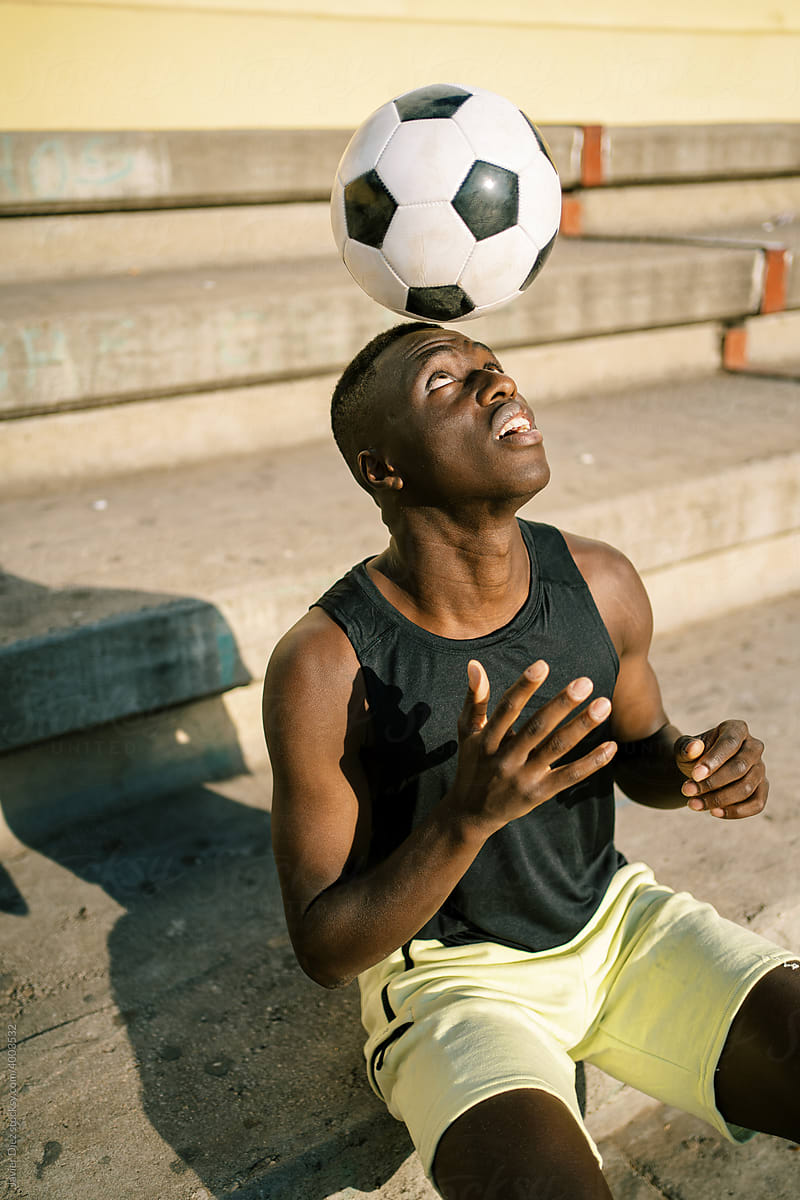 Black football player during training