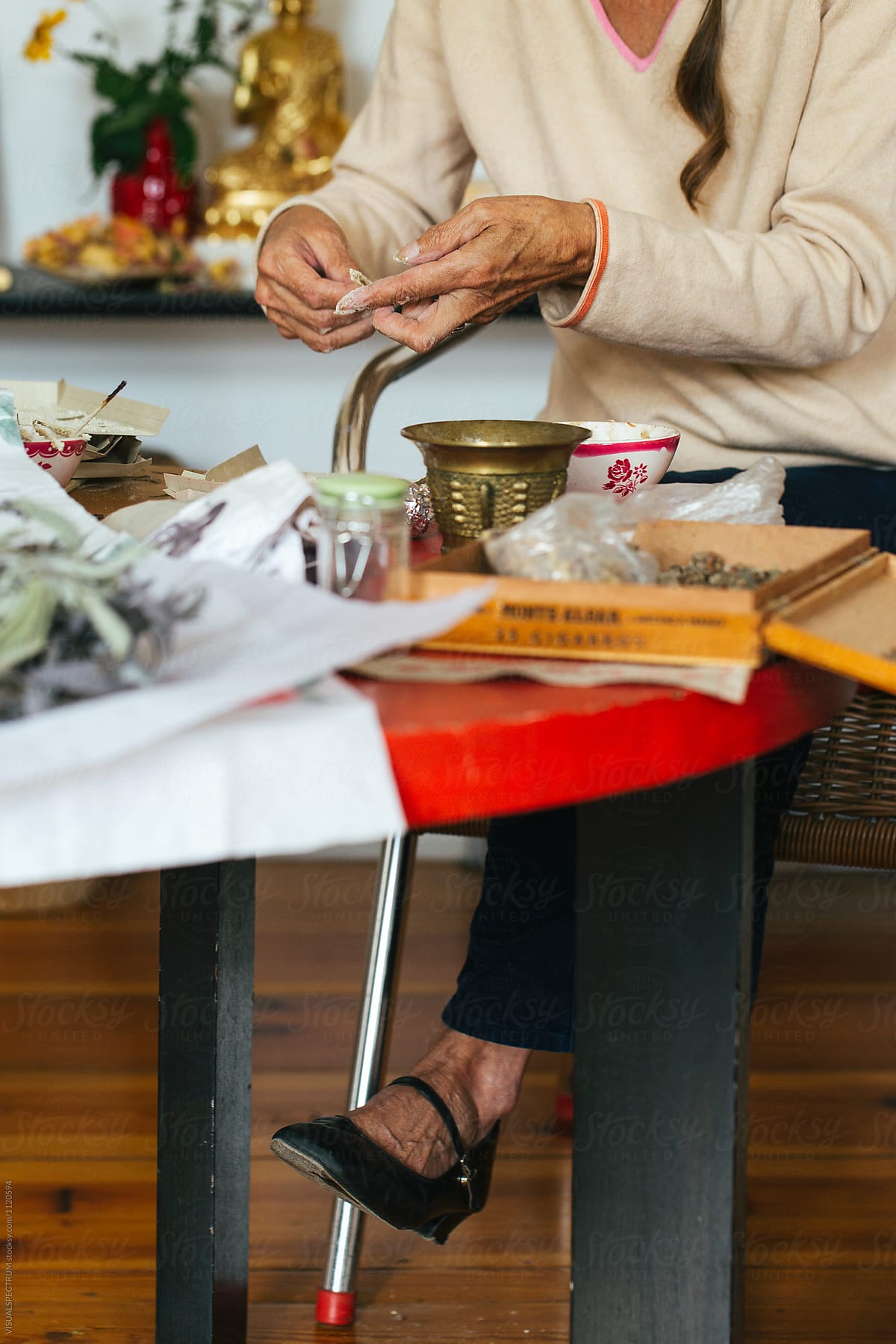 Closeup of Elderly Woman Making Natural Incense Stick at Home