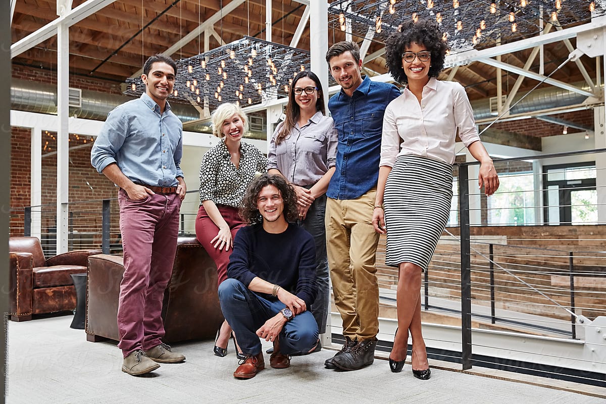 Group portrait of millennials in high tech office