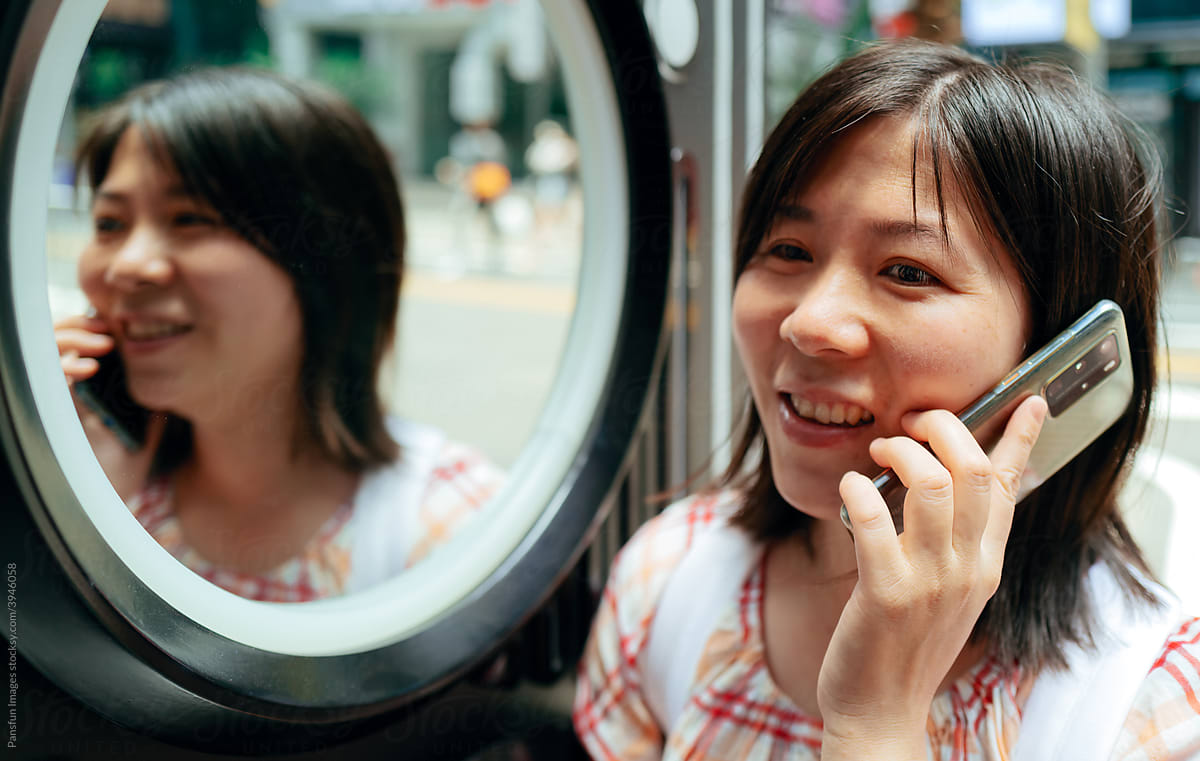 Asian women using cell phone
