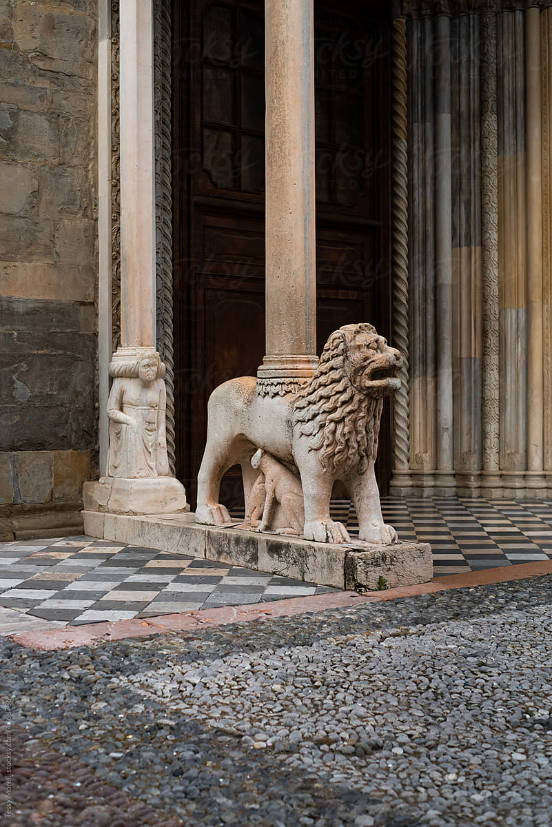 Antique lion sculpture in Italian square