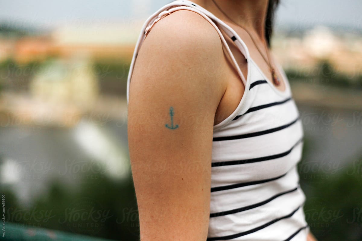 Female hand with an anchor tattoo