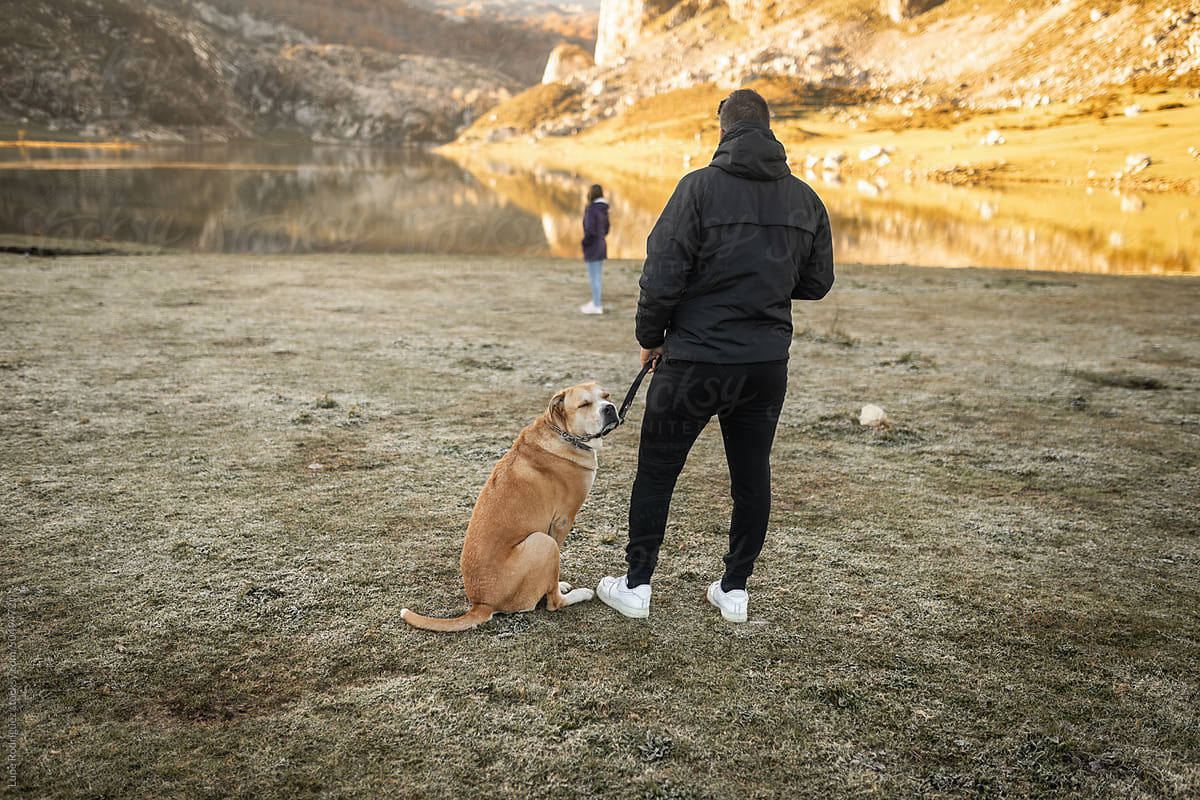young couple in nature with their dog