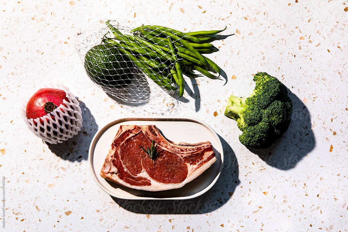 Meat beef steak, vegetables, fruit with flash light