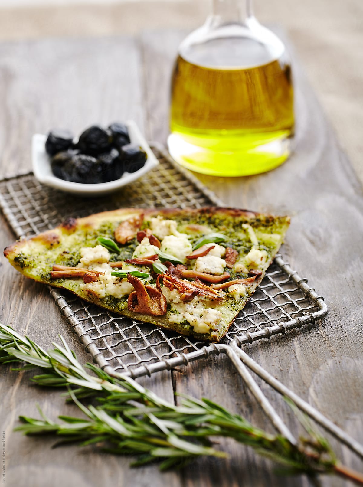 Pizza with olive oil, rosemary and olives
