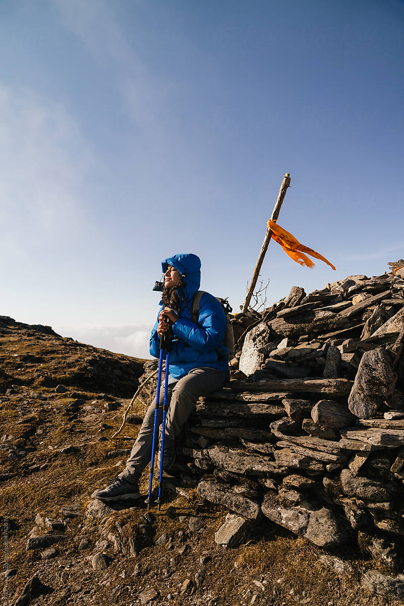 Woman taking a rest from trekking