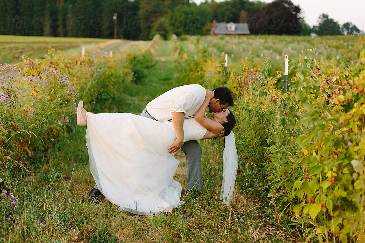 Wedding Couple Dips and Kisses at Farm