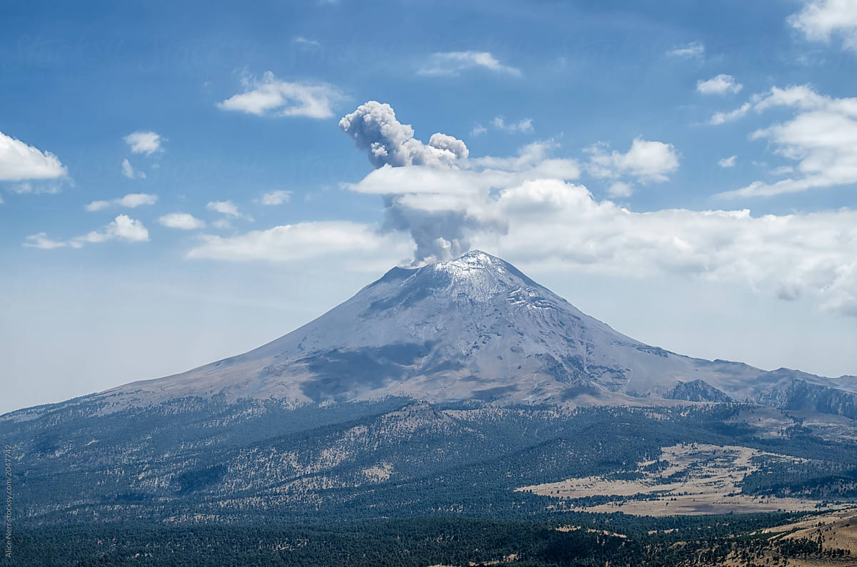 "Ash Cloud Above Active Volcano" by Stocksy Contributor "Alice Nerr