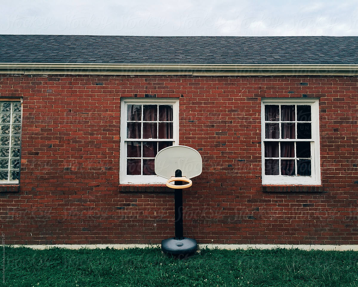 A children\'s basketball hoop outside of a day care center