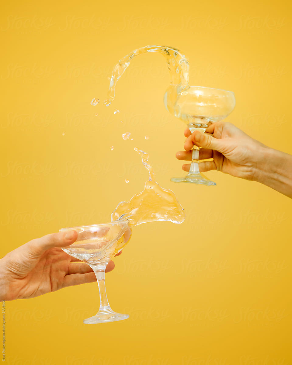 People splashing champagne from glasses