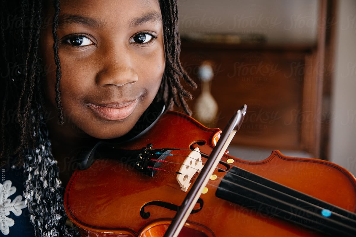 Smiling Black Girl Playing A Violin Stocksy United 