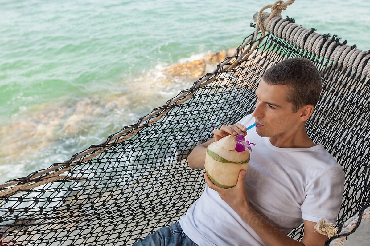 Man Drinking Coconut In The Hammock by Mosuno - Summer, Vacation