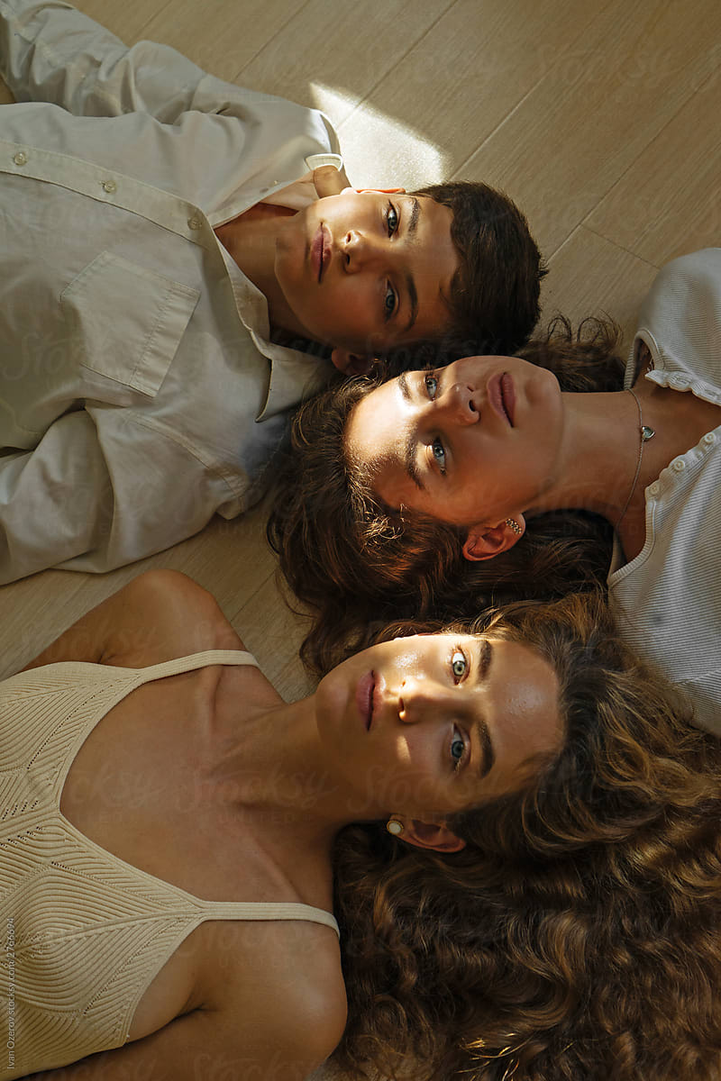 top view of a group of teenagers lying on the floor