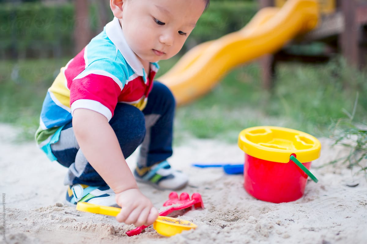 Kid playing in sandpit