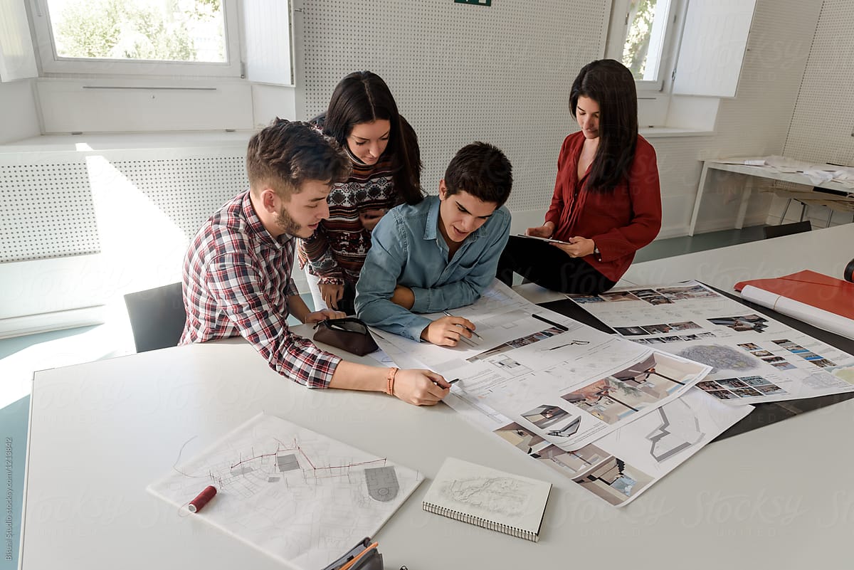 Four students of architectural department in classroom