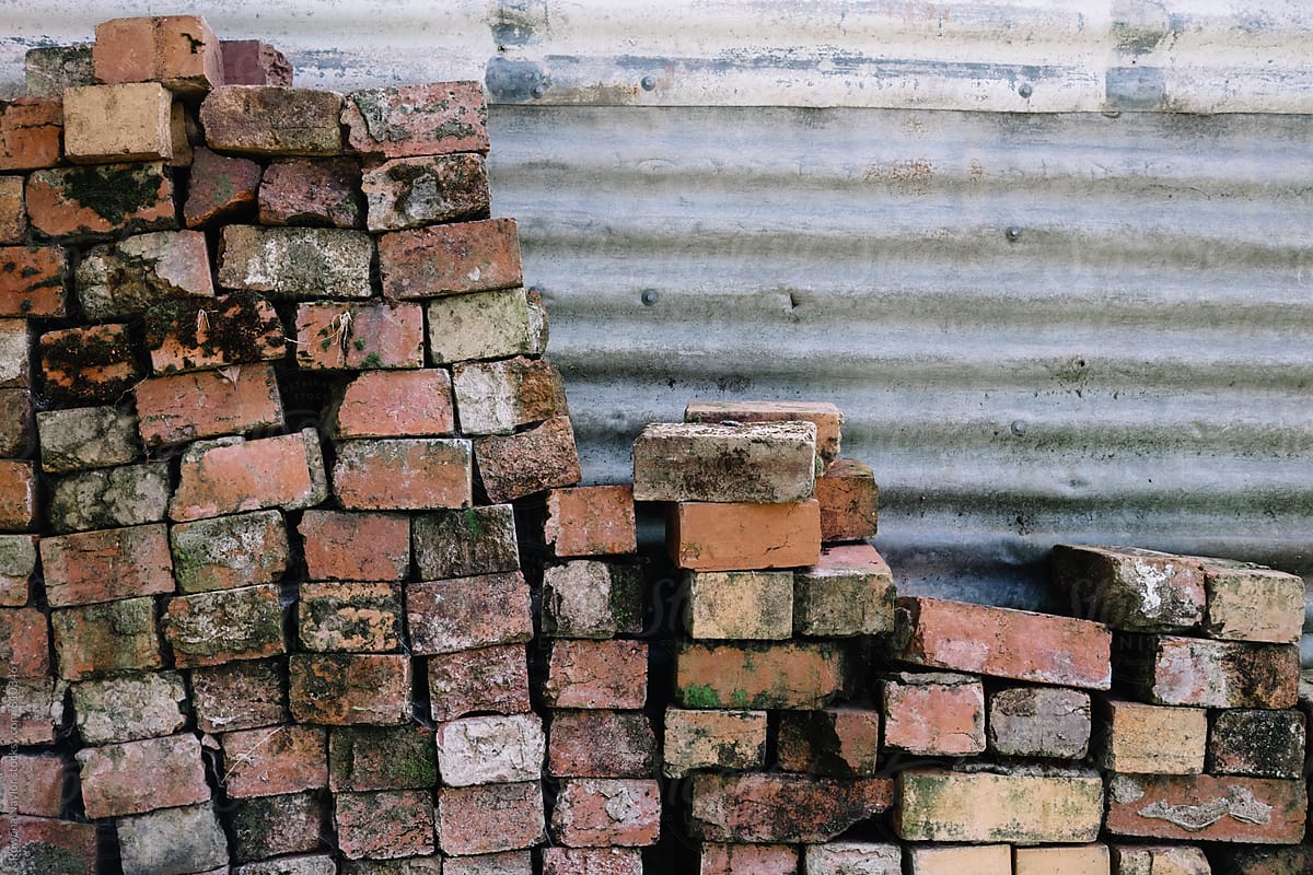 Old bricks piled against shed