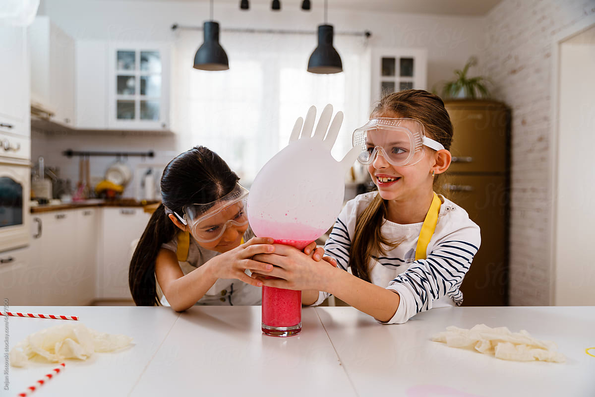 Children doing experiments with home food supplies and having fun