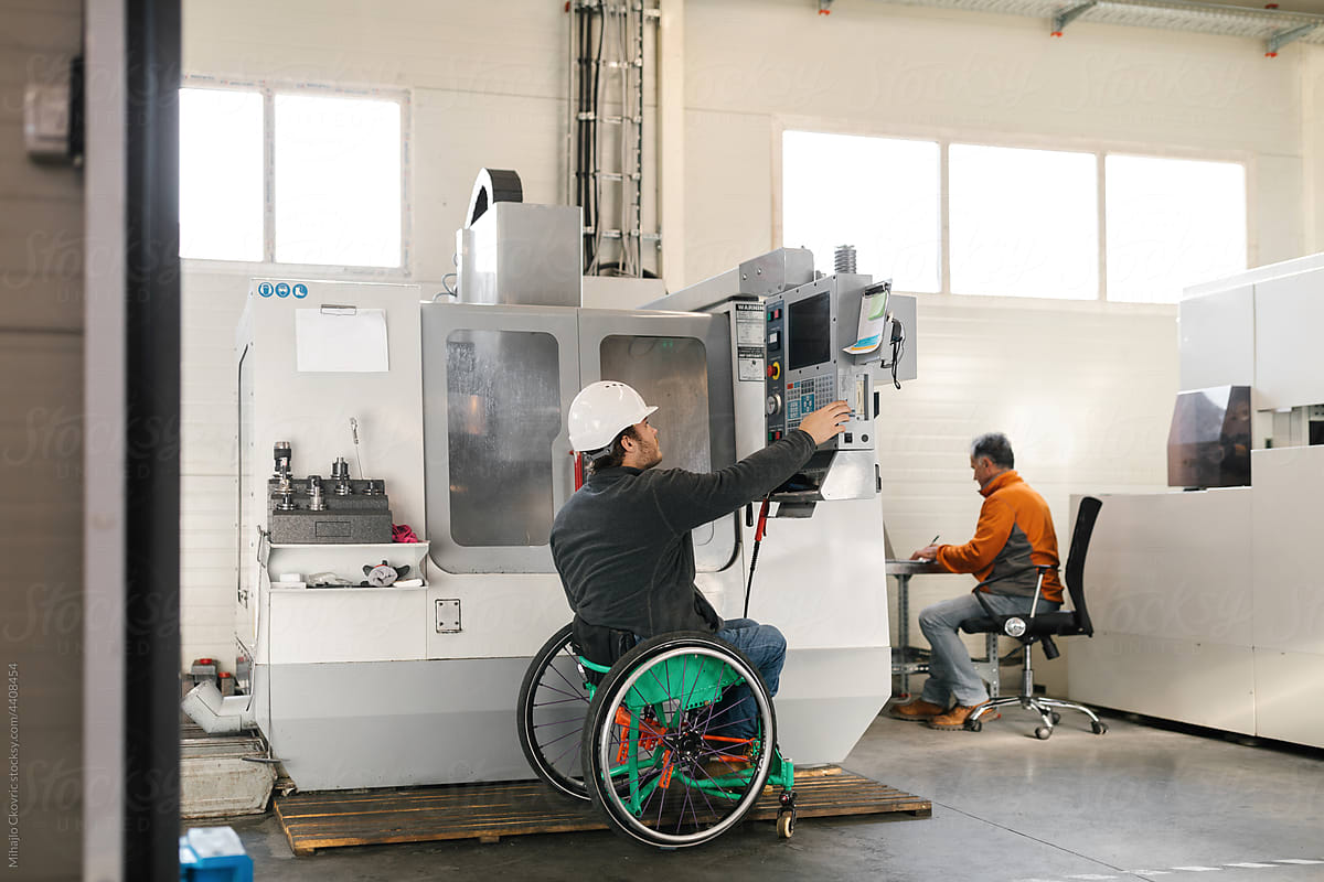 Disabled Worker Working With A Machine