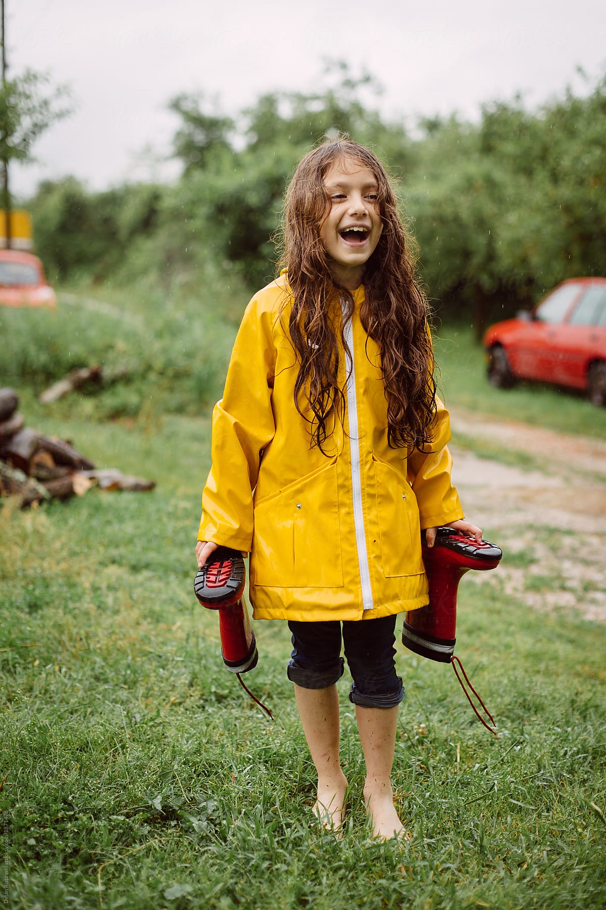 Young girl enjoys the rain