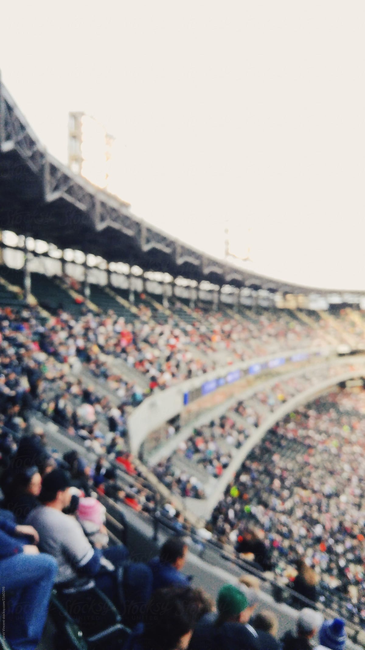 blurred baseball stadium crowd