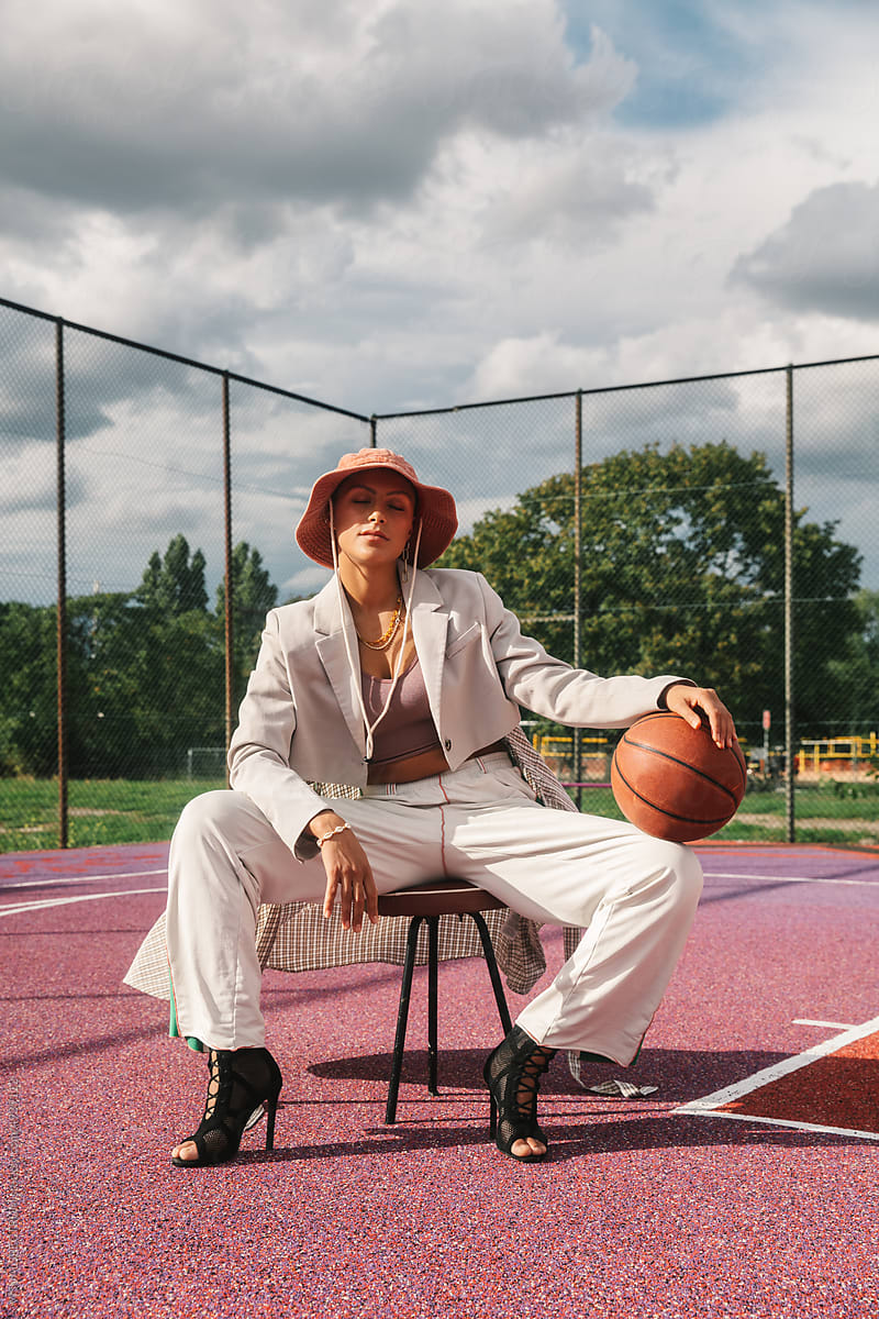 Hip Young Woman Posing in Streetwear on Basketball Court