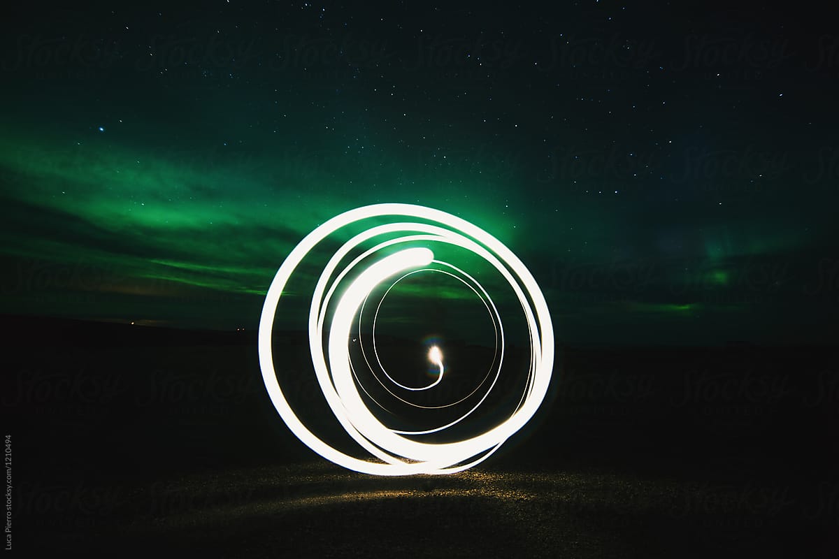 Light painting of circles under northern lights, Norway