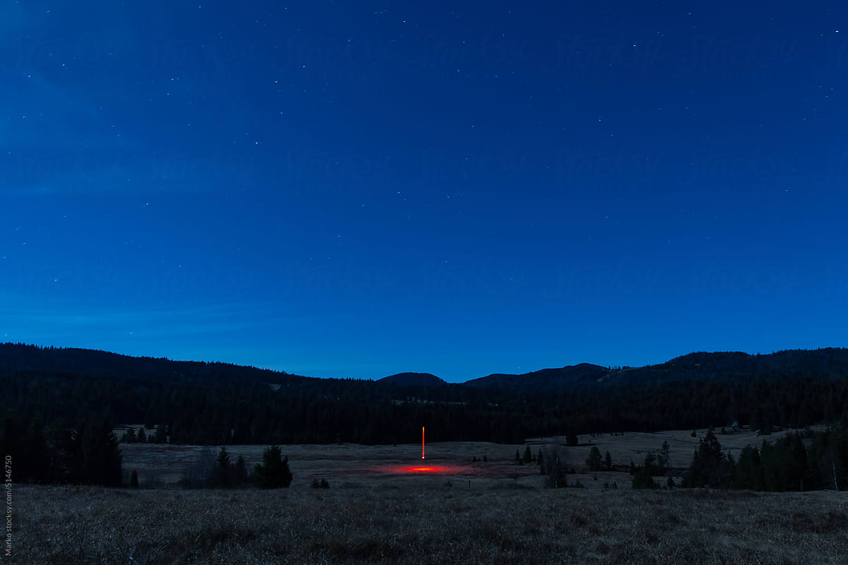 Thin red line mountain landscape stars night