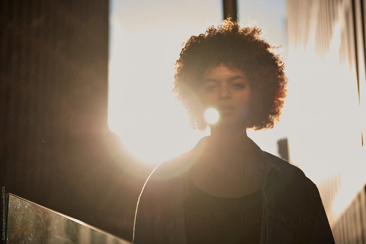 Portrait Of Young Woman With Afro Looking At Camera By Stocksy Contributor Guille Faingold 