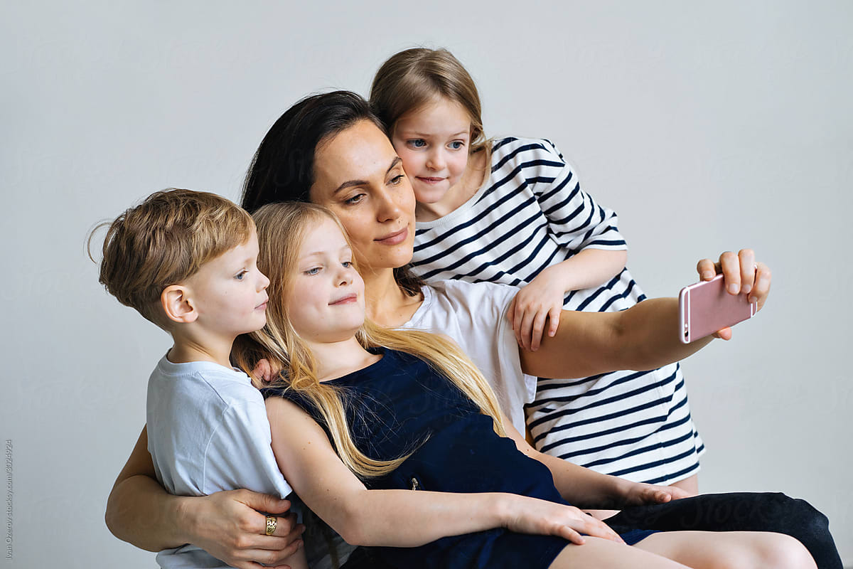 happy family taking selfie on the phone